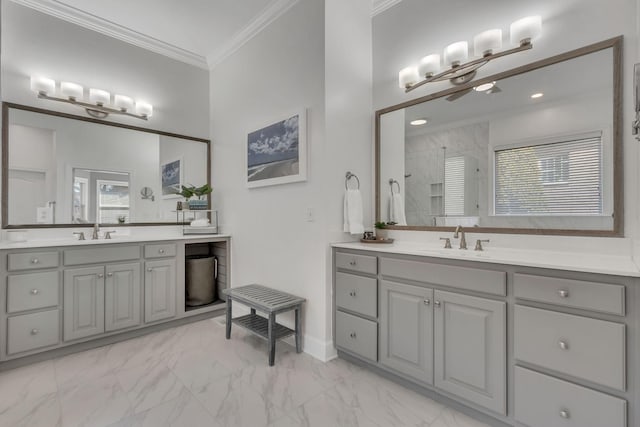 full bathroom with marble finish floor, ornamental molding, a tile shower, and a sink