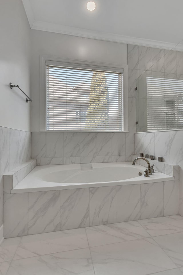 bathroom with walk in shower, a bath, and crown molding