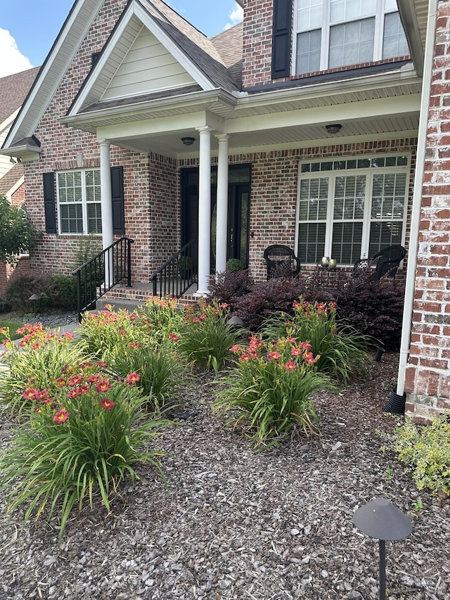 3009 Stewart Campbell Pt, Spring Hill, TN 37174 - doorway to property with covered porch and brick siding