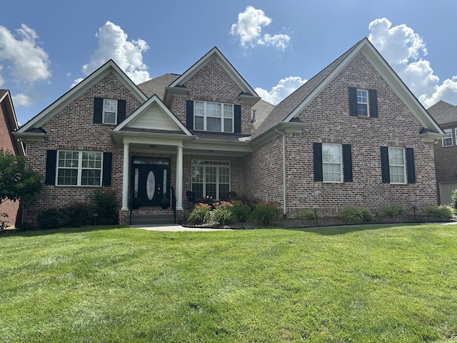 3009 Stewart Campbell Pt, Spring Hill, TN 37174 - view of front facade with brick siding and a front lawn