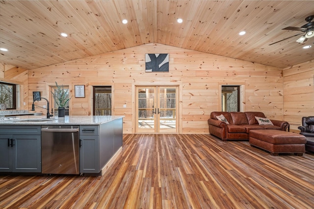 kitchen with vaulted ceiling, open floor plan, french doors, gray cabinets, and dishwasher