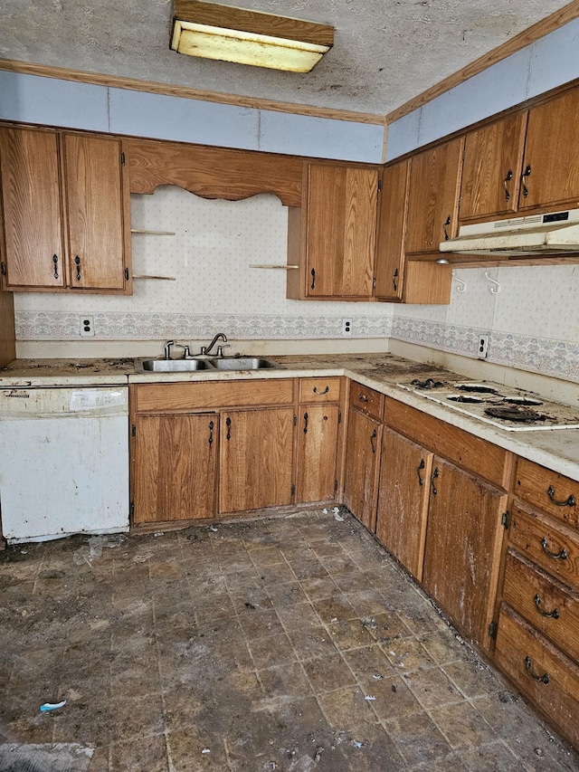 kitchen featuring brown cabinets, white appliances, a sink, and under cabinet range hood