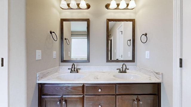 bathroom featuring double vanity and a sink