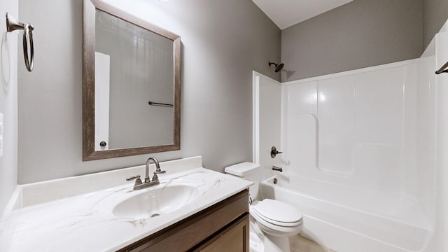 bathroom featuring shower / washtub combination, vanity, and toilet