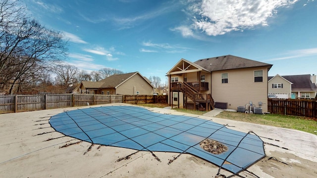 view of swimming pool with a patio area, a fenced backyard, stairway, and a fenced in pool