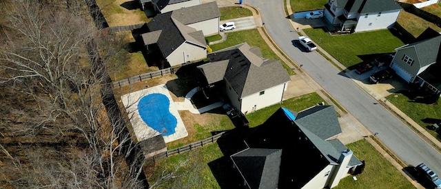 birds eye view of property with a residential view