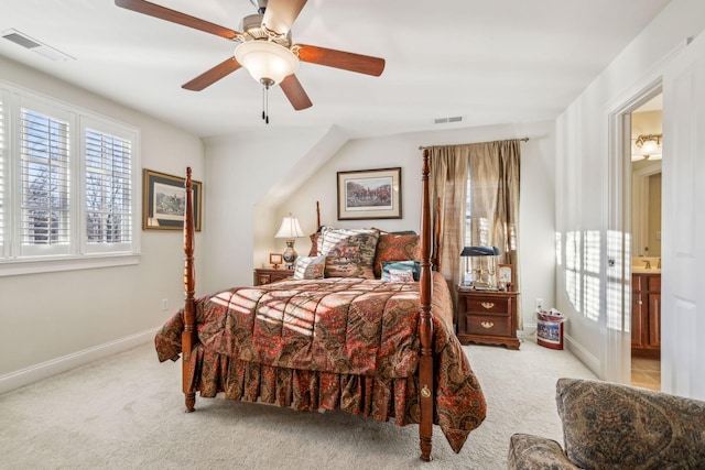 bedroom featuring light colored carpet, visible vents, connected bathroom, and baseboards