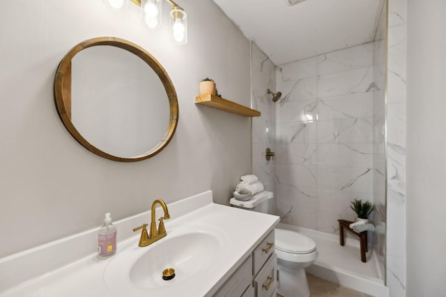 full bath with vanity, a shower stall, and toilet