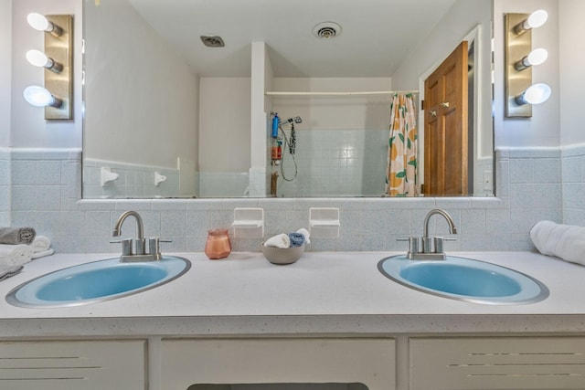 bathroom with visible vents, vanity, and a shower with curtain