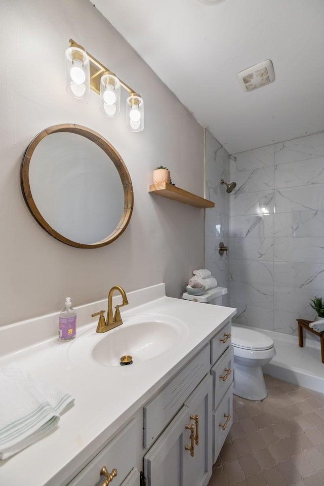 full bath featuring visible vents, toilet, vanity, and a tile shower