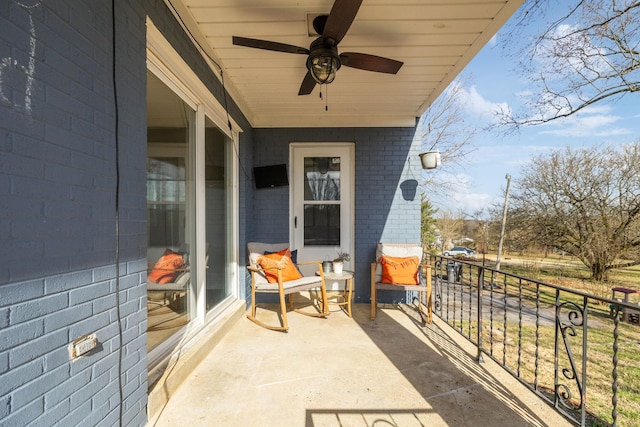 balcony featuring a ceiling fan