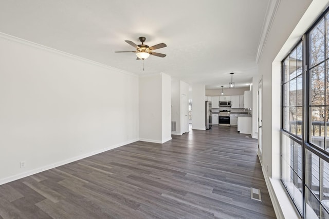 unfurnished living room featuring ornamental molding, dark wood-type flooring, and visible vents