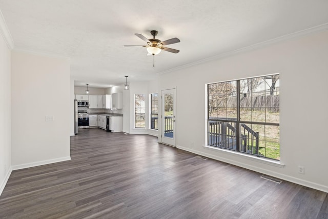 unfurnished living room with dark wood-style floors and crown molding