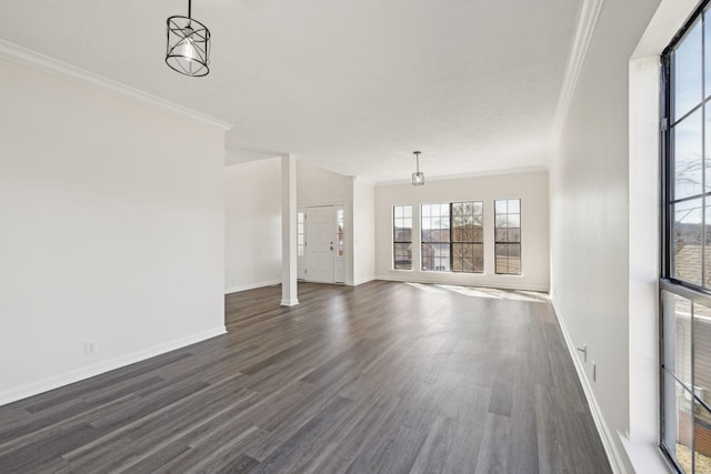 unfurnished living room featuring ornamental molding, dark wood-type flooring, and baseboards