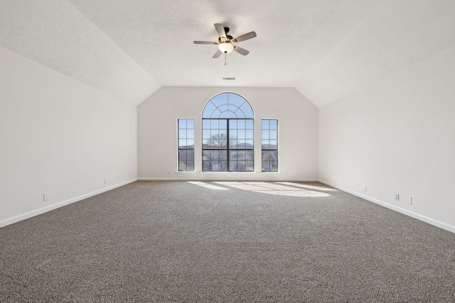 additional living space with vaulted ceiling, ceiling fan, carpet, and baseboards