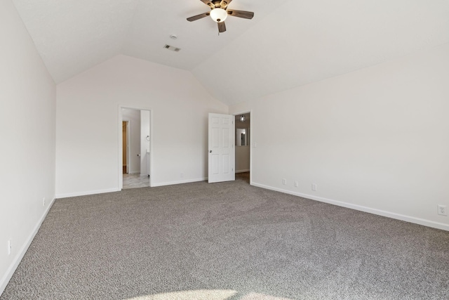 unfurnished bedroom with vaulted ceiling, carpet floors, visible vents, and baseboards