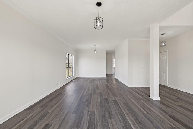 unfurnished living room with dark wood-type flooring, crown molding, and baseboards