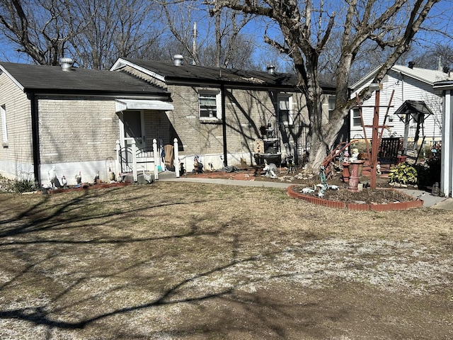 exterior space featuring brick siding