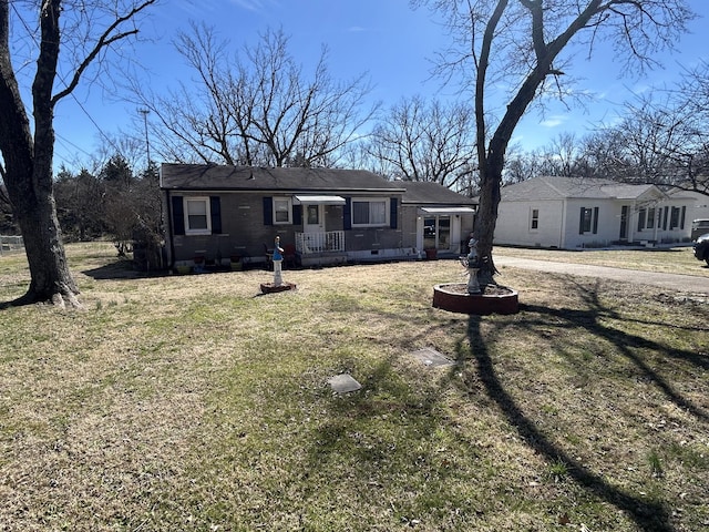 ranch-style home with brick siding, crawl space, and a front yard