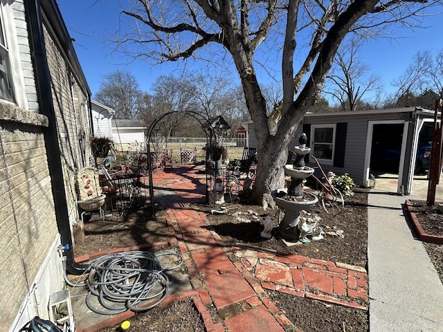 view of yard with fence and a patio