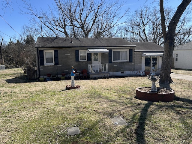 ranch-style home with a front yard, crawl space, and brick siding