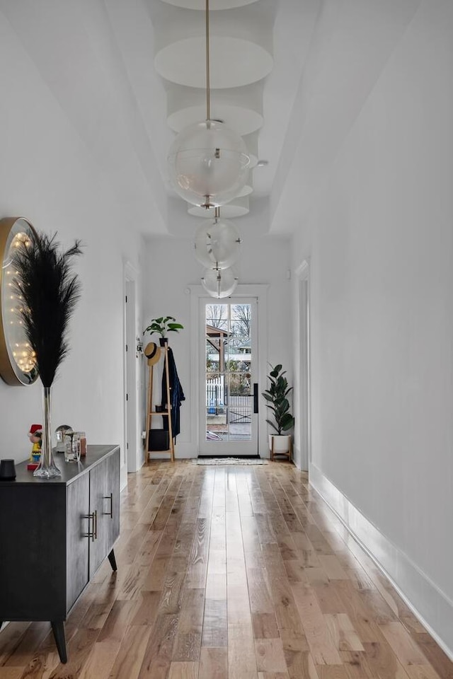 interior space with light wood-type flooring and baseboards