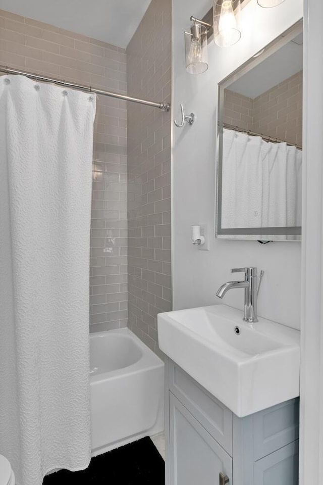 bathroom with vanity and shower / bathtub combination with curtain