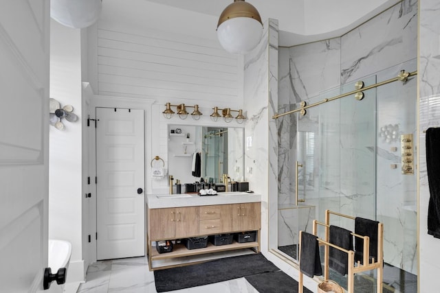 bathroom featuring marble finish floor, vanity, and a marble finish shower