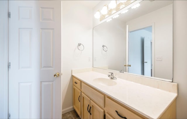 bathroom featuring tile patterned flooring and vanity