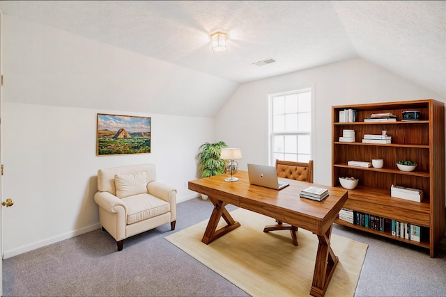 carpeted office space with lofted ceiling, visible vents, a textured ceiling, and baseboards