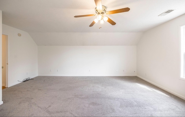 bonus room featuring carpet, visible vents, lofted ceiling, and baseboards