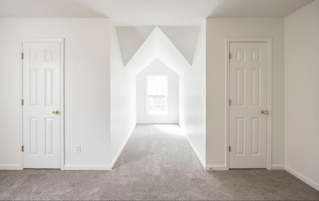 hall with carpet and baseboards