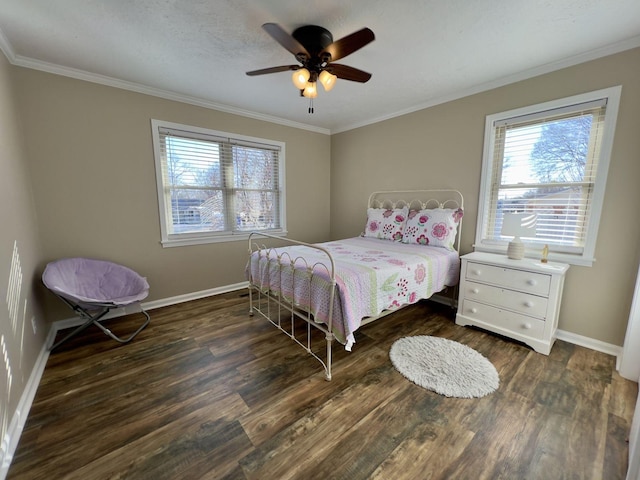 bedroom featuring baseboards, wood finished floors, and ornamental molding