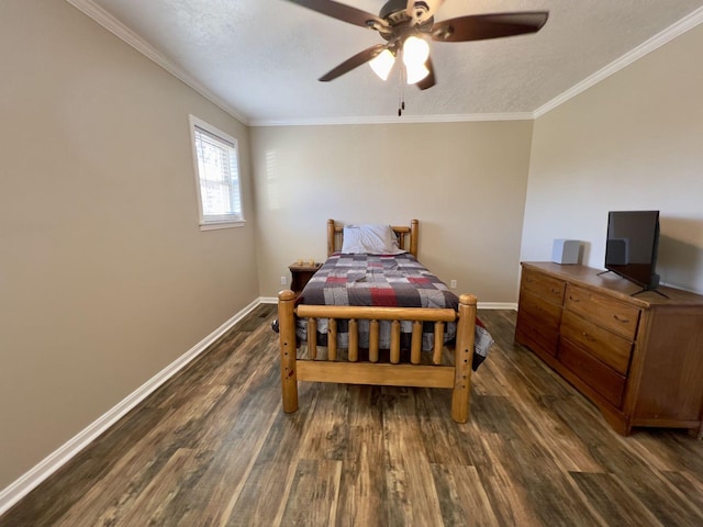 bedroom featuring crown molding, a textured ceiling, baseboards, and wood finished floors