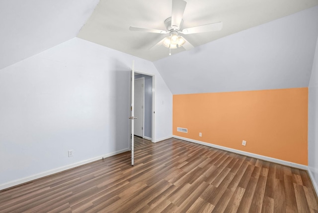 bonus room with lofted ceiling, visible vents, ceiling fan, wood finished floors, and baseboards