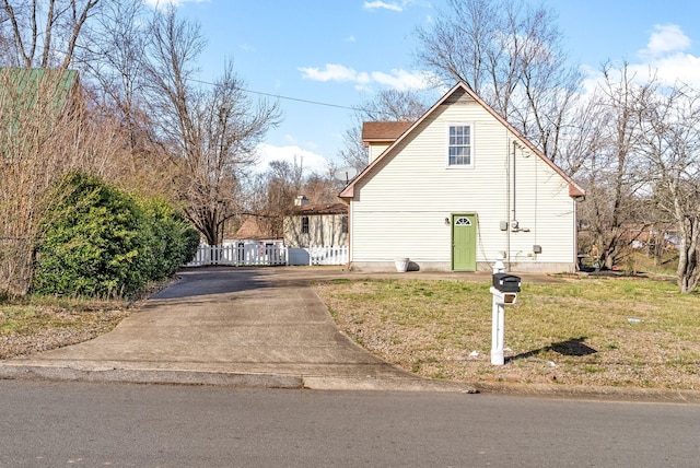 view of side of property with a lawn