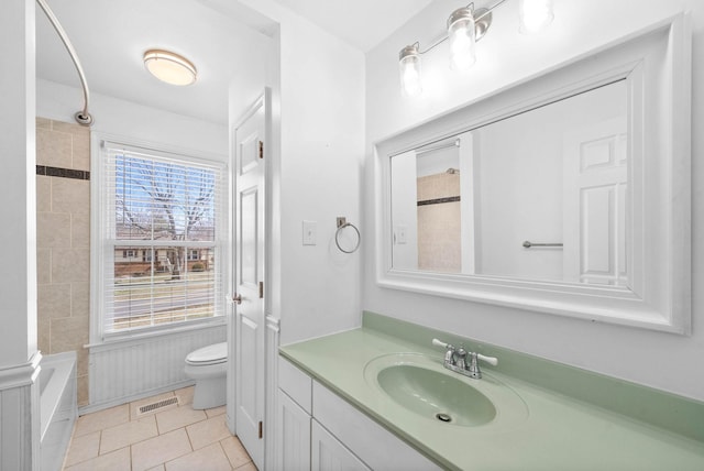 full bath with toilet, vanity, visible vents, and tile patterned floors