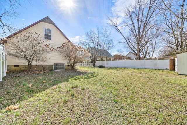 view of yard with fence and central AC unit