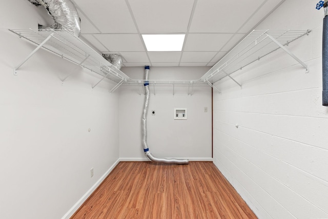 clothes washing area with laundry area, washer hookup, baseboards, light wood finished floors, and electric dryer hookup