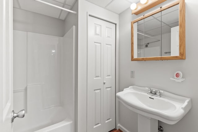 bathroom featuring a sink and shower / bathing tub combination