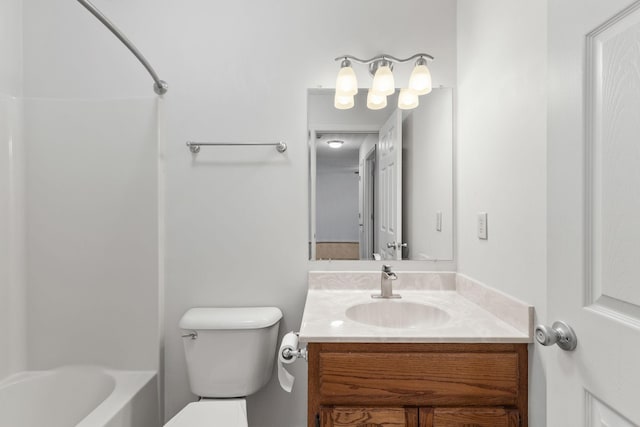 bathroom with shower / bathing tub combination, vanity, and toilet