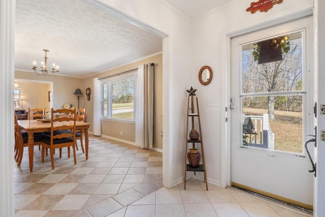 dining area featuring a chandelier, a textured ceiling, light tile patterned flooring, baseboards, and ornamental molding