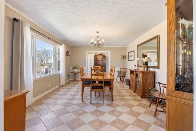 dining space featuring a chandelier, crown molding, a textured ceiling, and baseboards