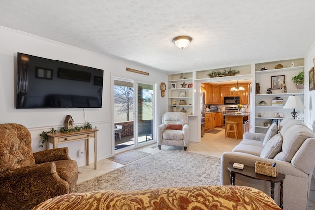 living area with a textured ceiling, built in shelves, light tile patterned flooring, and a notable chandelier