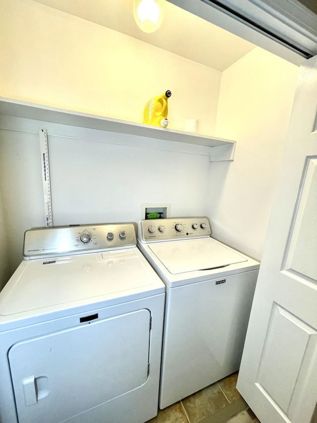 laundry room with laundry area and washing machine and clothes dryer