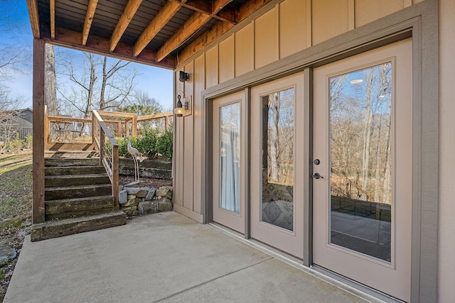 doorway to outside featuring unfinished concrete floors