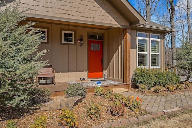 view of exterior entry featuring board and batten siding