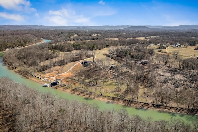 drone / aerial view with a water and mountain view