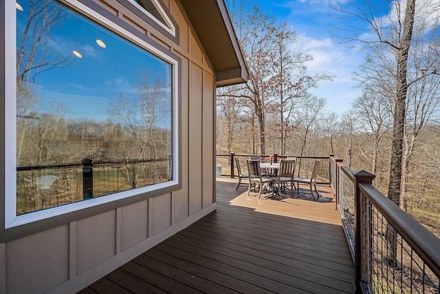 deck featuring outdoor dining area