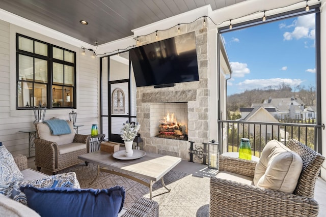 view of patio / terrace featuring an outdoor living space with a fireplace